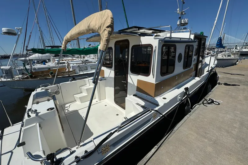 Point Aft'r Yacht Photos Pics 2012 Ranger Tugs R-29 docked, showcasing spacious deck and cabin design.