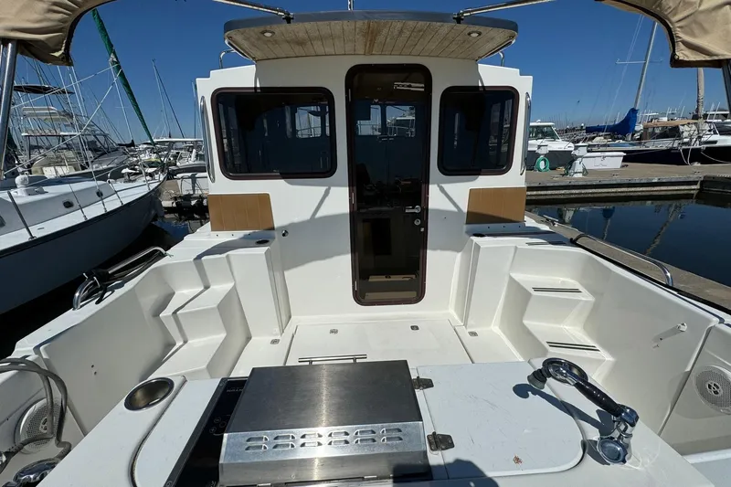 Point Aft'r Yacht Photos Pics 2012 Ranger Tugs R-29 boat cockpit with seating, docked at marina.