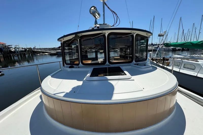 Point Aft'r Yacht Photos Pics 2012 Ranger Tugs R-29 boat docked at marina under clear blue sky.