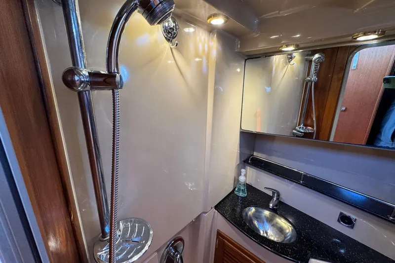 Point Aft'r Yacht Photos Pics 2012 Ranger Tugs R-29 bathroom with shower, sink, and mirror.