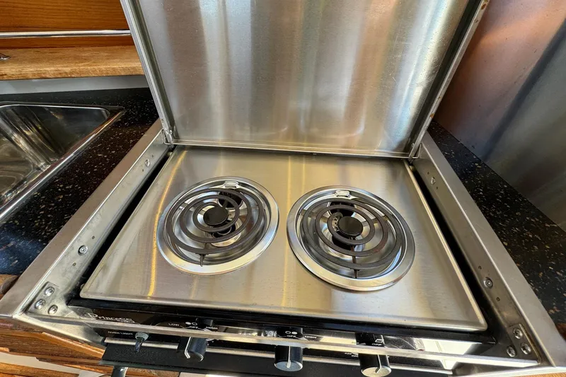 Point Aft'r Yacht Photos Pics Stainless steel stove with two burners in 2012 Ranger Tugs R-29 boat kitchen.