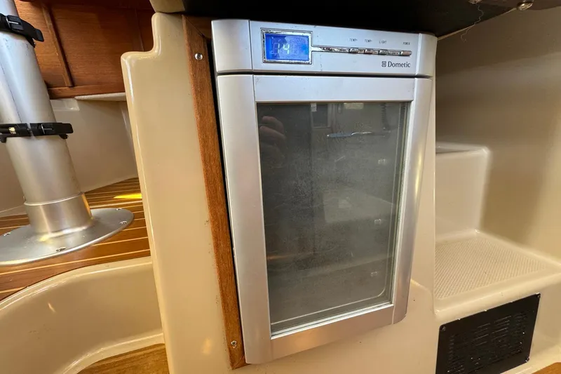 Point Aft'r Yacht Photos Pics 2012 Ranger Tugs R-29 interior with Dometic fridge, wooden accents, and modern design.