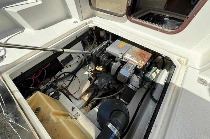 Point Aft'r Yacht Photos Pics Engine compartment of a 2012 Ranger Tugs R-29 boat, showing mechanical components and wiring.