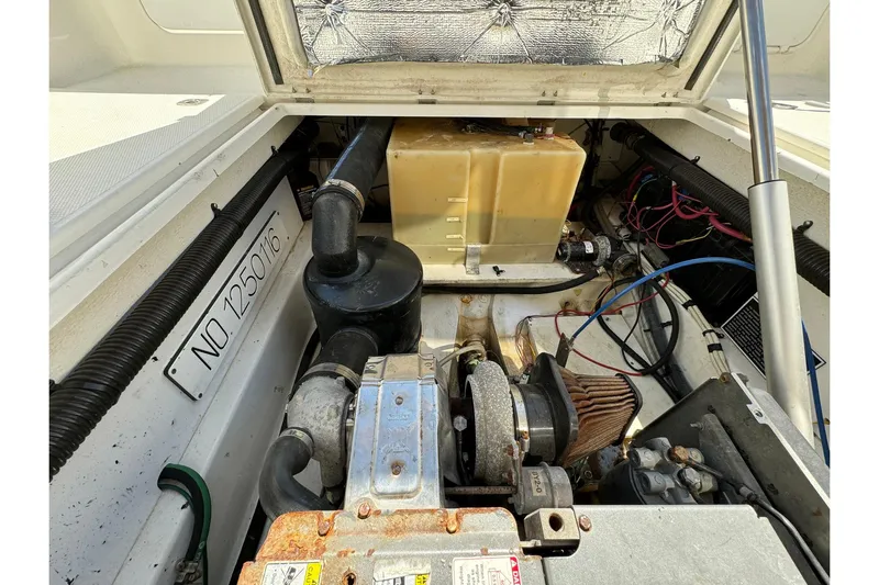 Point Aft'r Yacht Photos Pics Engine compartment of a 2012 Ranger Tugs R-29 boat, showing mechanical components.