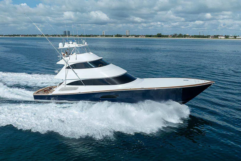 Bella Yacht Photos Pics 2018 Viking 92 Sky Bridge yacht cruising on open water.