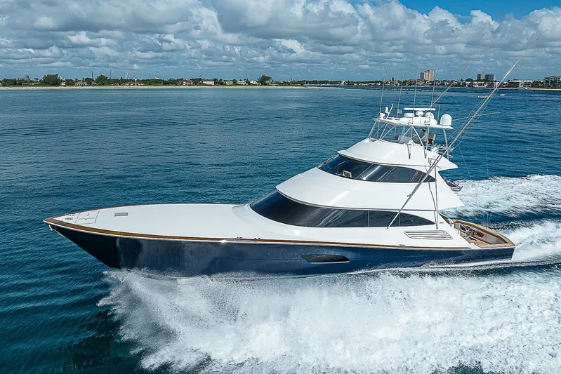 Bella Yacht Photos Pics 2018 Viking 92 Sky Bridge yacht cruising on open water.