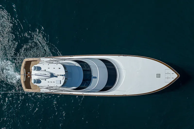 Bella Yacht Photos Pics Aerial view of 2018 Viking 92 Sky Bridge yacht cruising on the ocean.