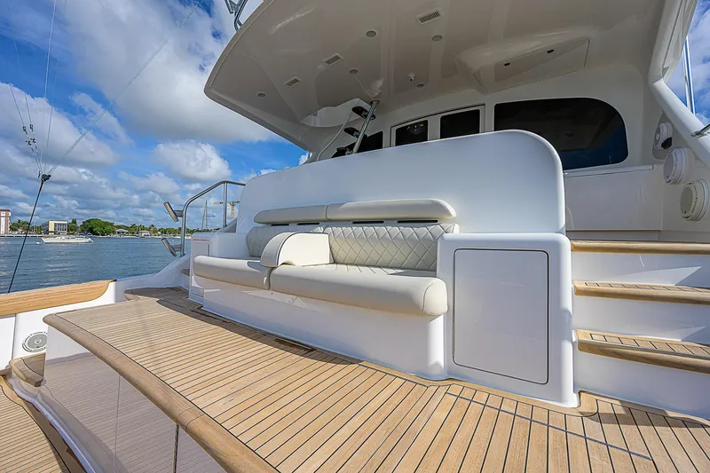 Bella Yacht Photos Pics 2018 Viking 92 Sky Bridge yacht with spacious deck and seating area.