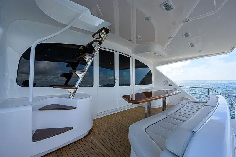 Bella Yacht Photos Pics Luxurious 2018 Viking 92 Sky Bridge yacht with elegant seating and ocean view.