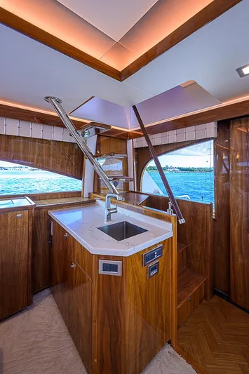 Bella Yacht Photos Pics Interior of 2018 Viking 92 Sky Bridge yacht with modern kitchen and ocean view.