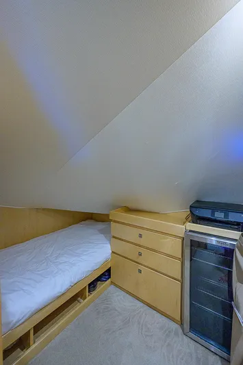 Bella Yacht Photos Pics Cozy cabin bed in 2018 Viking 92 Sky Bridge yacht with storage drawers.