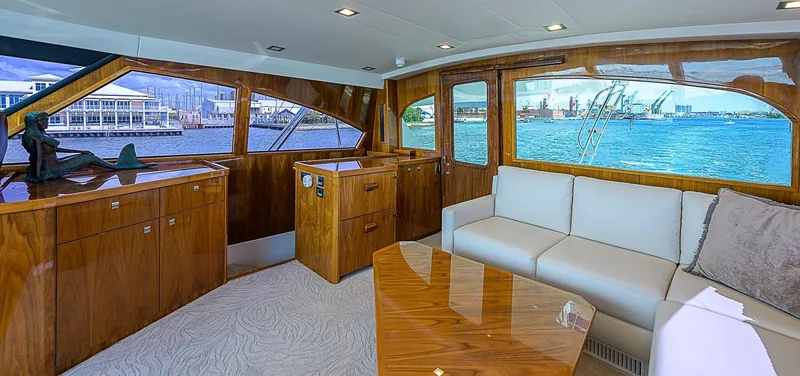 Bella Yacht Photos Pics Luxurious interior of 2018 Viking 92 Sky Bridge yacht with waterfront view.