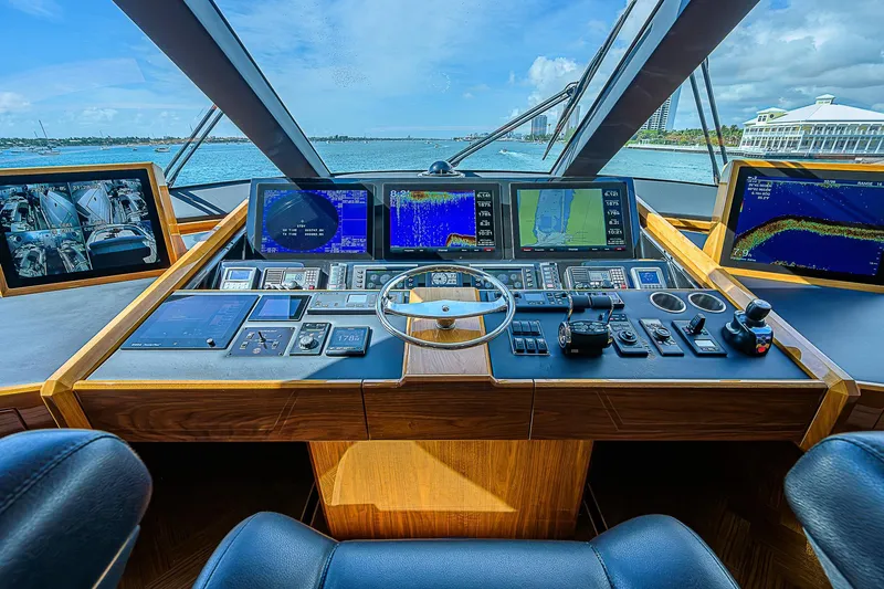 Bella Yacht Photos Pics Cockpit of 2018 Viking 92 Sky Bridge yacht with advanced navigation systems.