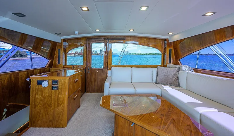 Bella Yacht Photos Pics Luxurious interior of a 2018 Viking 92 Sky Bridge yacht with panoramic windows.