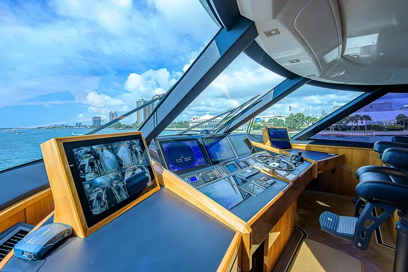 Bella Yacht Photos Pics 2018 Viking 92 Sky Bridge yacht helm with advanced navigation systems and panoramic views.