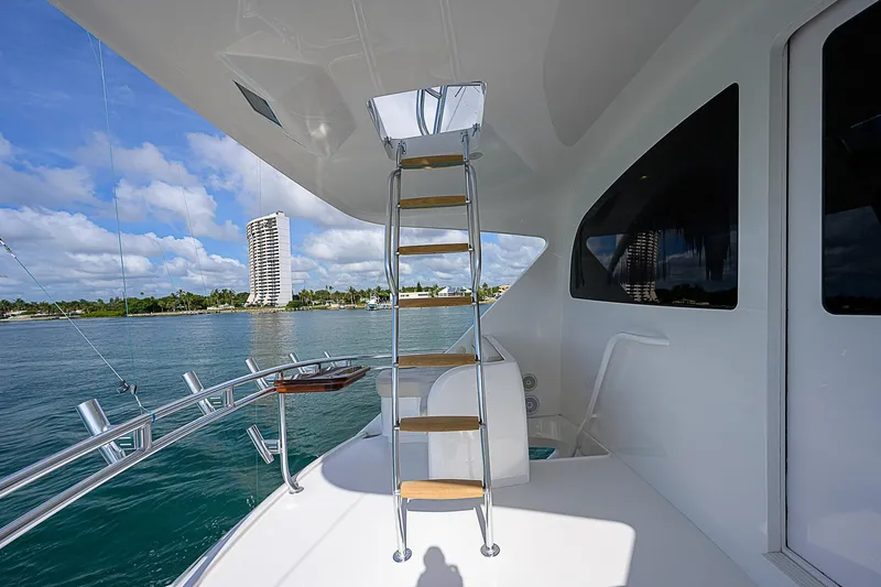 Bella Yacht Photos Pics Ladder on the deck of a 2018 Viking 92 Sky Bridge yacht with ocean view.