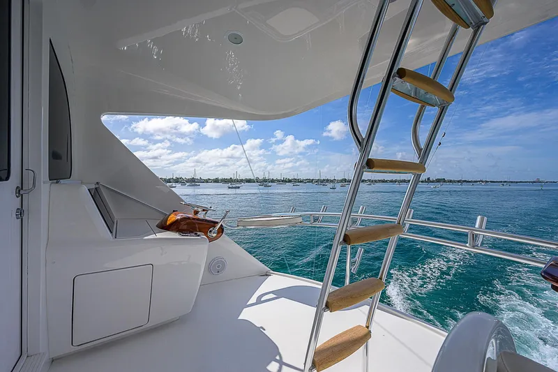 Bella Yacht Photos Pics 2018 Viking 92 Sky Bridge yacht with ocean view and ladder.