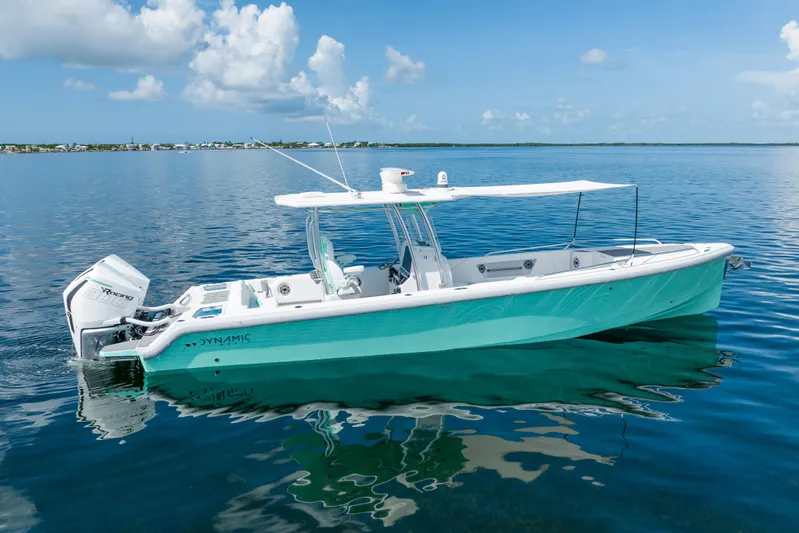  Yacht Photos Pics 2024 Dynamic D-305V boat on calm water with clear blue sky.