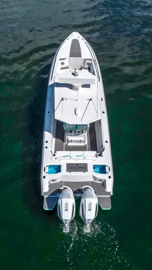  Yacht Photos Pics Aerial view of 2024 Dynamic D-305V boat with twin engines on water.