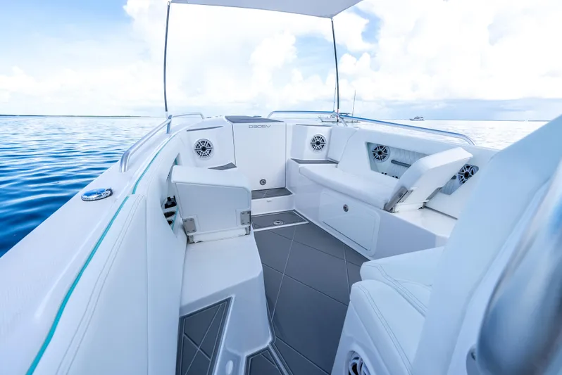  Yacht Photos Pics Luxurious interior of the 2024 Dynamic D-305V boat with white seating and ocean view.