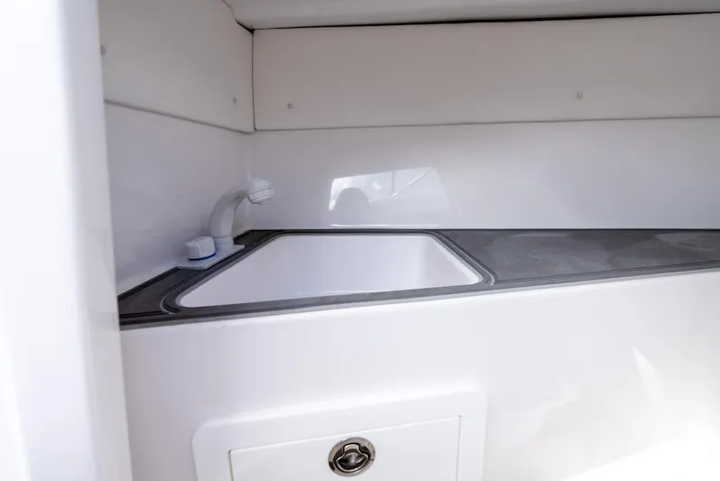  Yacht Photos Pics 2024 Dynamic D-305V boat sink and countertop in white interior.
