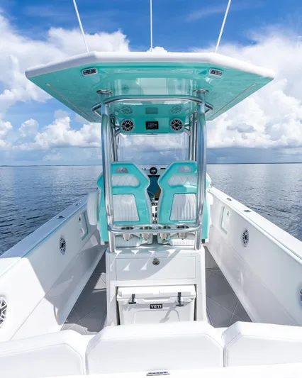  Yacht Photos Pics 2024 Dynamic D-305V boat with turquoise seating and modern helm station.