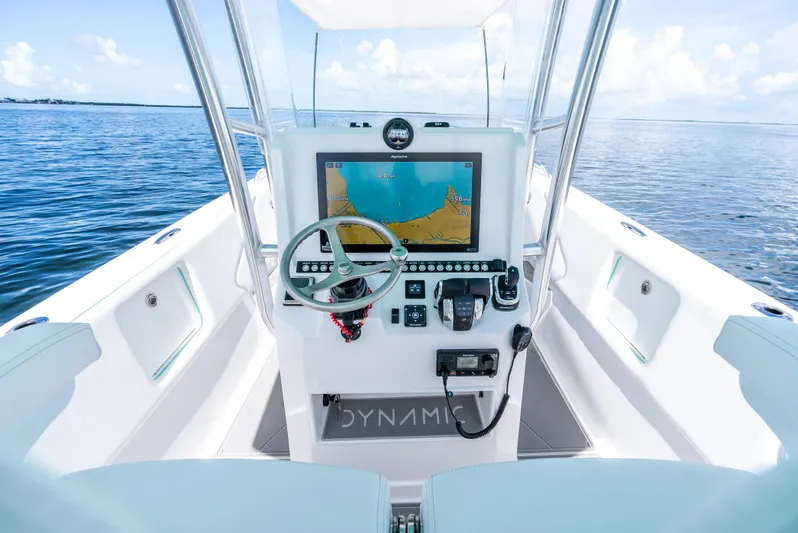  Yacht Photos Pics 2024 Dynamic D-305V boat console with navigation system on open water.