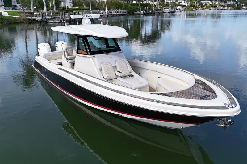  Yacht Photos Pics 2020 Chris-Craft Catalina 34 boat on calm water, featuring sleek design and luxury seating.