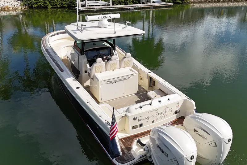  Yacht Photos Pics 2020 Chris-Craft Catalina 34 boat with dual Yamaha engines on a calm lake.