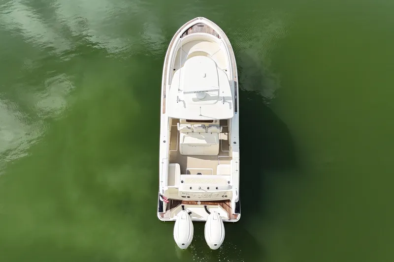  Yacht Photos Pics 2020 Chris-Craft Catalina 34 boat on calm green water, aerial view.