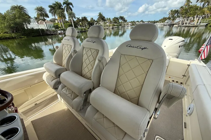  Yacht Photos Pics 2020 Chris-Craft Catalina 34 boat interior with luxurious seating and scenic waterfront view.