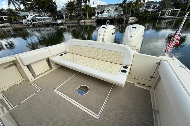  Yacht Photos Pics 2020 Chris-Craft Catalina 34 boat interior with cushioned seating and twin outboard engines.