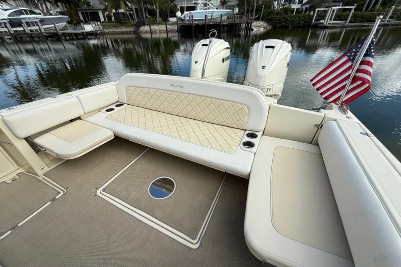  Yacht Photos Pics 2020 Chris-Craft Catalina 34 boat interior with seating and American flag.