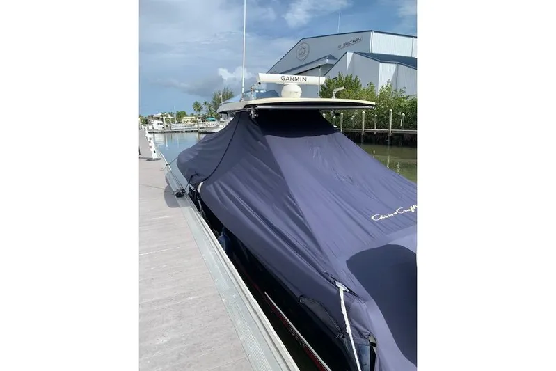  Yacht Photos Pics 2020 Chris-Craft Catalina 34 covered at dock, featuring Garmin equipment.