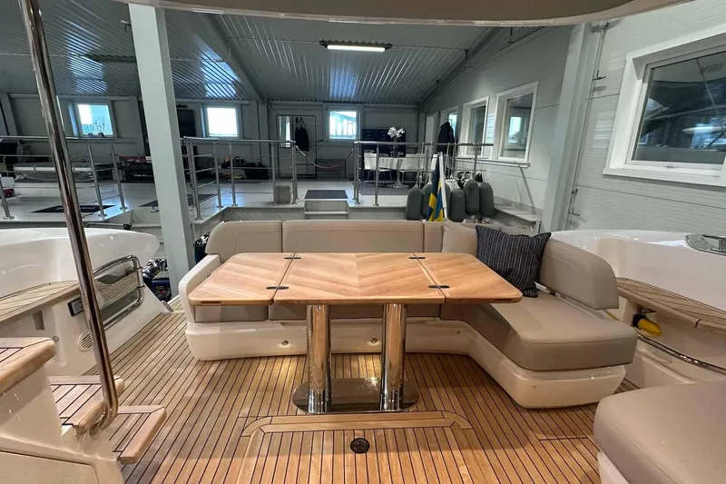 F45079 Yacht Photos Pics Luxurious 2022 Princess F45 yacht interior with elegant seating and wooden table.