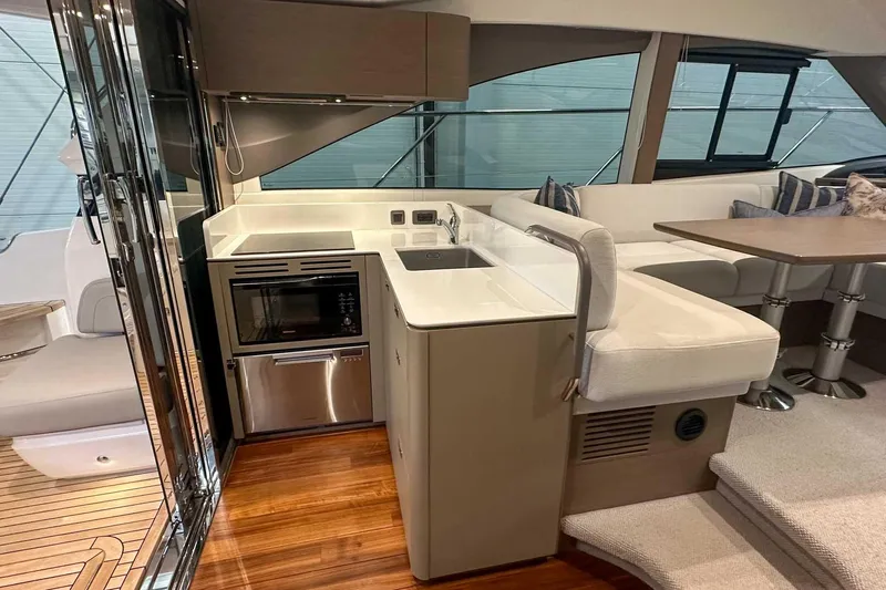 F45079 Yacht Photos Pics Luxurious interior of 2022 Princess F45 yacht with modern kitchen and seating area.