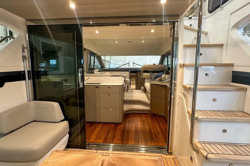 F45079 Yacht Photos Pics Luxurious interior of 2022 Princess F45 yacht with elegant seating and wooden flooring.
