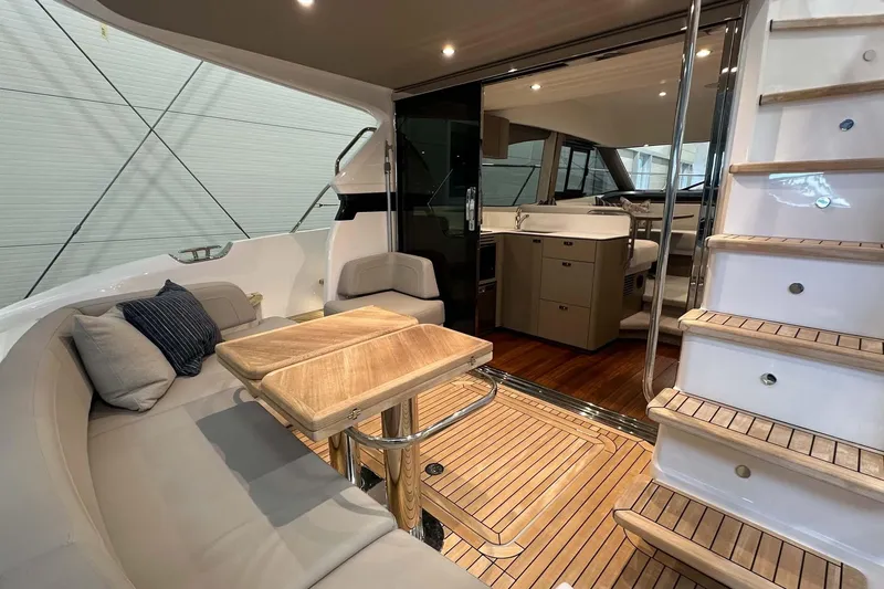 F45079 Yacht Photos Pics Luxurious 2022 Princess F45 yacht interior with elegant seating and wooden accents.