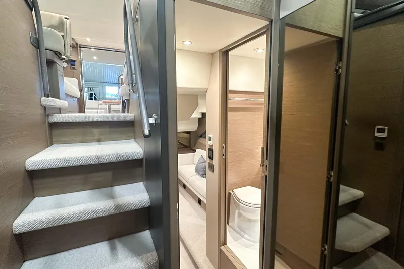 F45079 Yacht Photos Pics Luxurious interior of 2022 Princess F45 yacht, featuring stairs and modern bathroom.