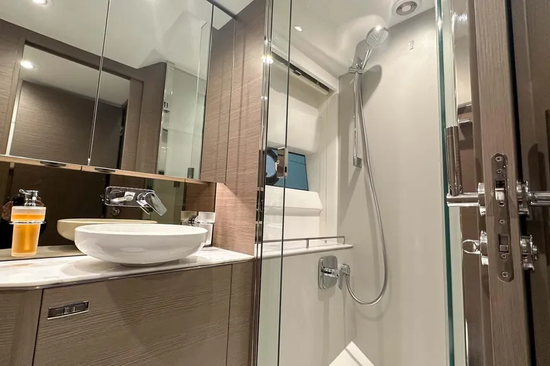 F45079 Yacht Photos Pics Luxurious bathroom in 2022 Princess F45 yacht with modern fixtures and elegant design.
