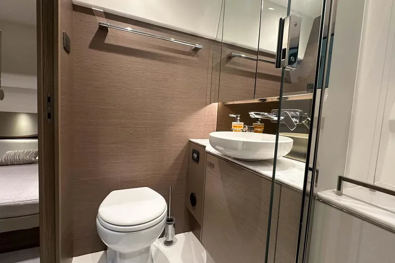 F45079 Yacht Photos Pics Luxurious bathroom in 2022 Princess F45 yacht with modern fixtures and elegant design.