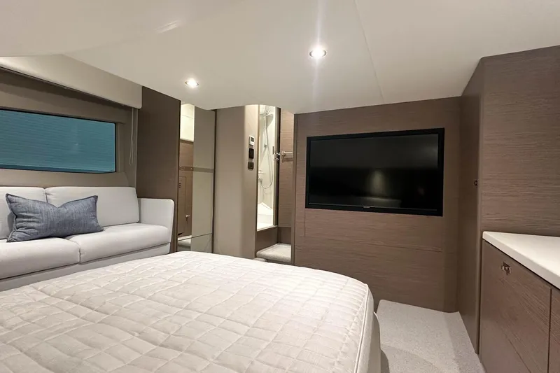 F45079 Yacht Photos Pics Luxurious interior of 2022 Princess F45 yacht with modern furnishings and flat-screen TV.