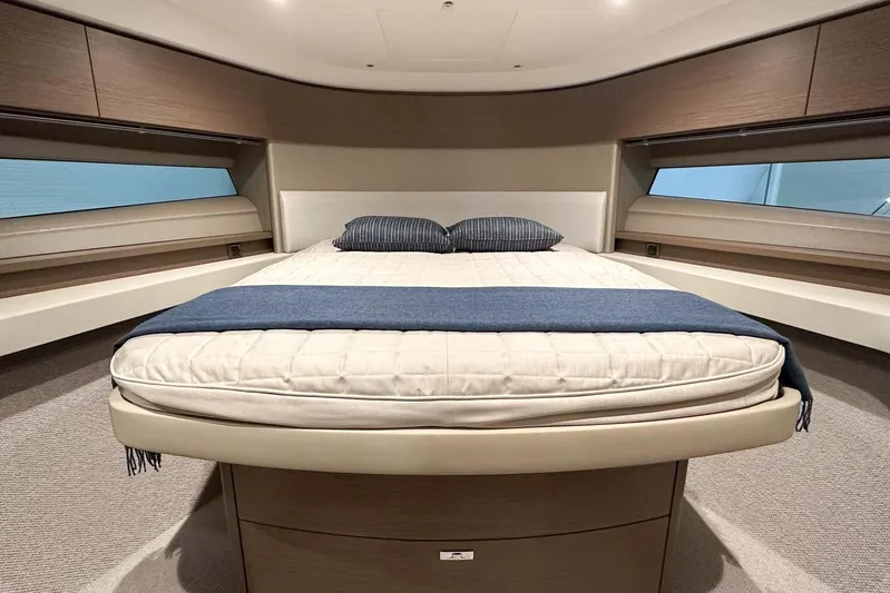 F45079 Yacht Photos Pics Luxurious bedroom interior of 2022 Princess F45 yacht with modern design and cozy bedding.