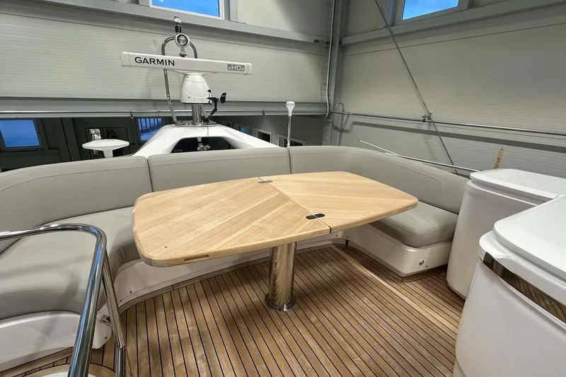 F45079 Yacht Photos Pics Luxurious 2022 Princess F45 yacht interior with wooden table and seating area.