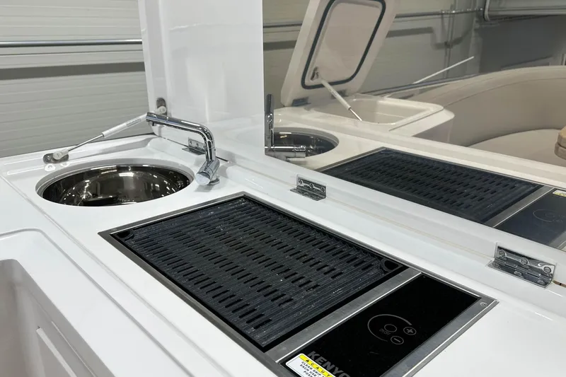 F45079 Yacht Photos Pics Modern kitchen area on 2022 Princess F45 yacht with sink and grill.