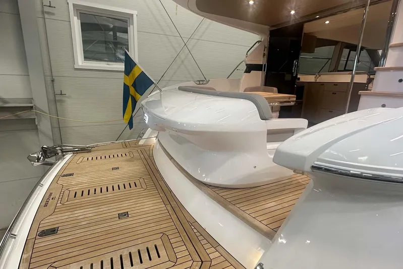 F45079 Yacht Photos Pics Luxurious 2022 Princess F45 yacht interior with wooden deck and Swedish flag.
