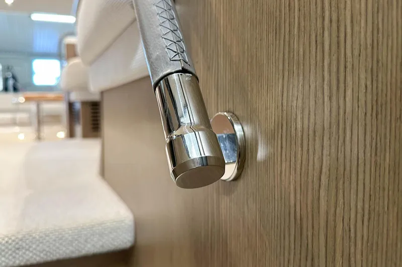 F45079 Yacht Photos Pics Close-up of a 2022 Princess F45 yacht interior detail with wood and metal accents.