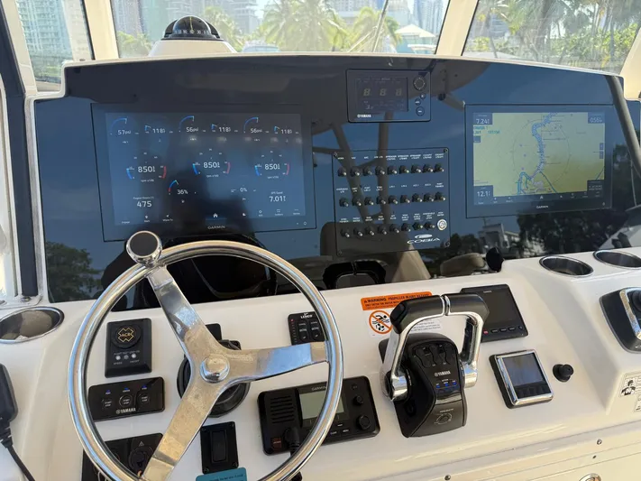  Yacht Photos Pics 2018 Cobia 344 Center Console boat dashboard with navigation and control systems.