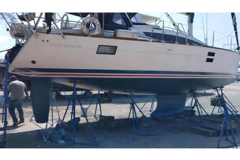  Yacht Photos Pics 2018 Elan Impression 40 sailboat on stands, undergoing maintenance in a boatyard.