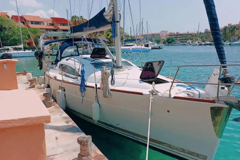  Yacht Photos Pics 2018 Elan Impression 40 yacht docked in a sunny marina.